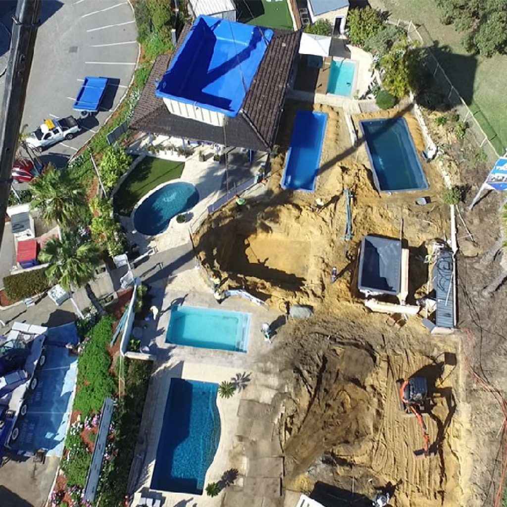Valentina pool design! - Slope no barrier to backyard haven - Aqua ...